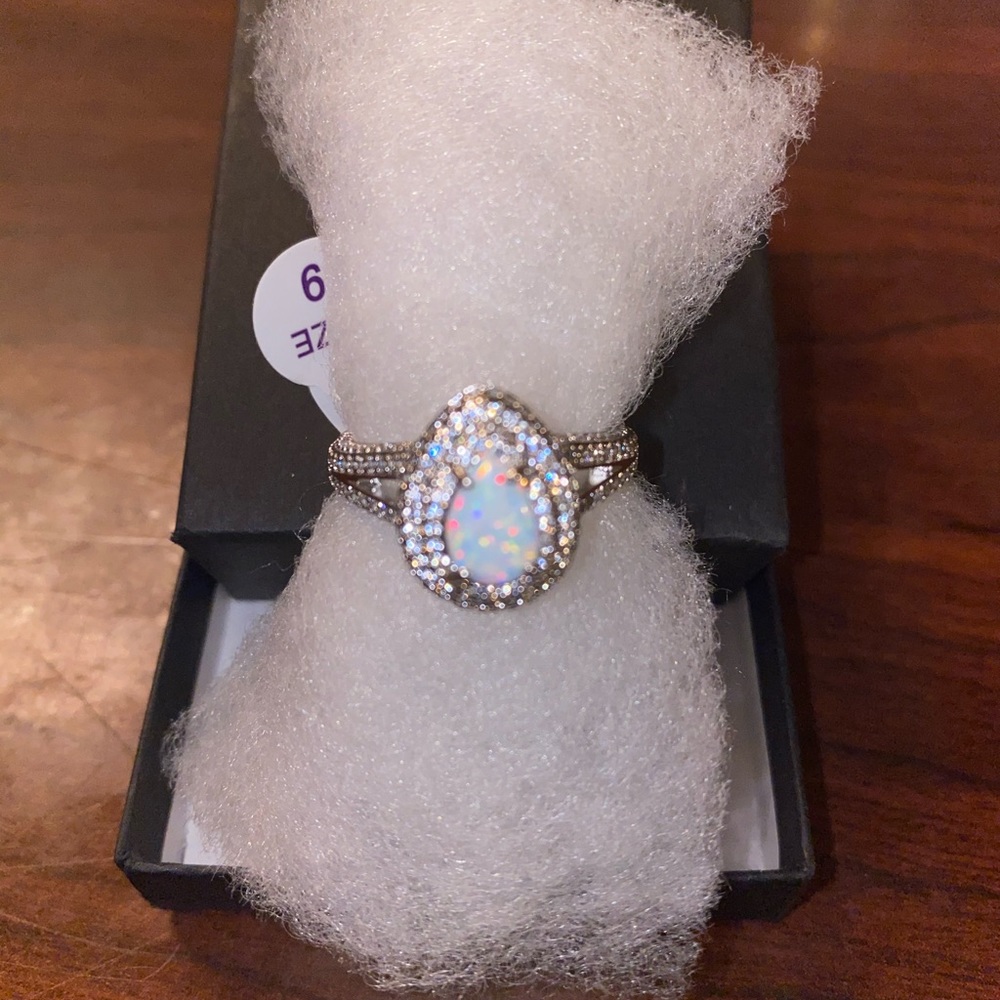 Ring bomb party white fire opal cruise ship ring